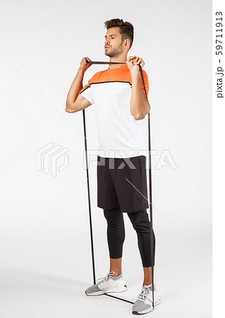 Vertical, full-length sportsman workout with loop band, stretch resistance rope with feet and arms 59711913