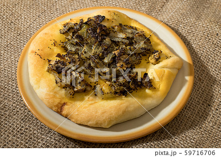 Homemade cebularz, Traditional Polish pancake with onion and common poppy seeds, from Jewish tradition, baked in Lublin, Poland. 59716706