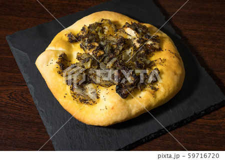 Homemade cebularz, Traditional Polish pancake with onion and common poppy seeds, from Jewish tradition, baked in Lublin, Poland. 59716720