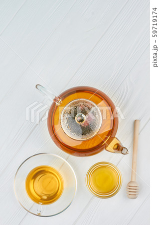 Teapot, honey and cup of tea. Teapot, honey and cup of tea. 59719174