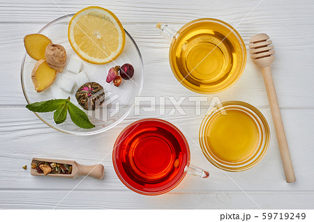 Flat lay composition with tea and honey on wooden background. Flat lay composition with tea and honey on wooden background. 59719249