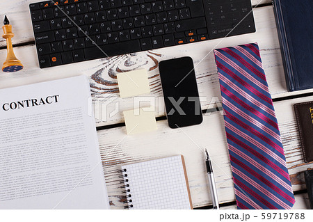 Tie, smartphone and keyboard. Tie, smartphone and keyboard. 59719788