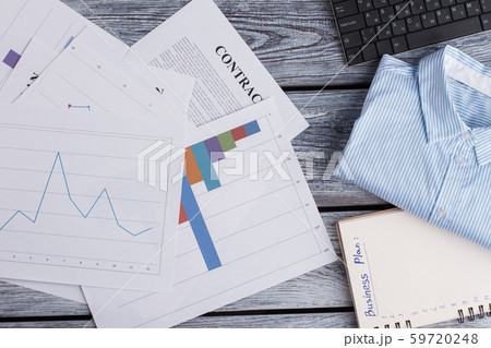 Papers and office items on wooden background. Papers and office items on wooden background. 59720248