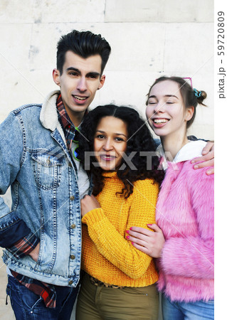 cute group of teenages at the building of university with books huggings, diversity nations real cute group of teenages at the building of university with books huggings, diversity nations real 59720809