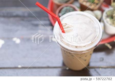 Close up glass of ice cappuccino coffee on wood Close up glass of ice cappuccino coffee on wood 59722702