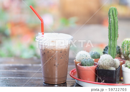 Close up glass of ice chocolate on wood table Close up glass of ice chocolate on wood table 59722703