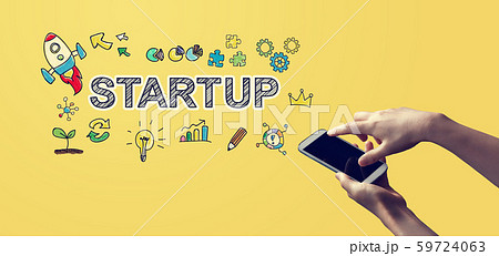 Startup with person holding smartphone Startup with person holding smartphone 59724063