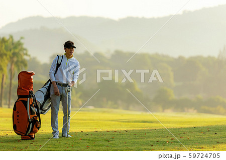 Professional Golfer asian man walking in fairway Professional Golfer asian man walking in fairway 59724705