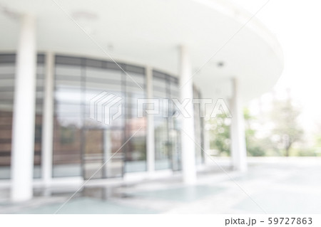 Blur office background building exterior view to lobby glass window wall with blurry light bokeh 59727863