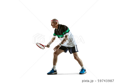 Senior man playing tennis in sportwear isolated on white background 59743987