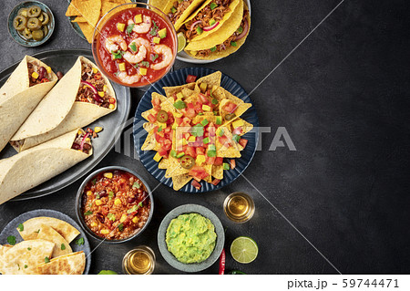 Mexican food, many dishes of the cuisine of Mexico, flat lay, top shot on a black background with a Mexican food, many dishes of the cuisine of Mexico, flat lay, top shot on a black background with a 59744471