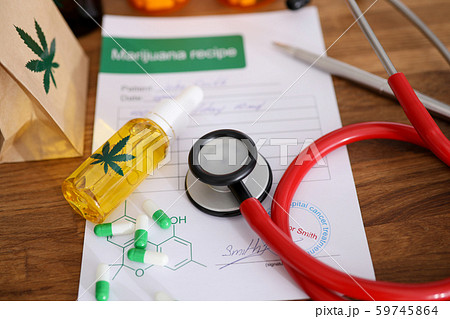 Red stethoscope with marijuana recipe on doctor Red stethoscope with marijuana recipe on doctor 59745864