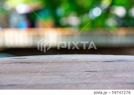 Empty curved wooden table texture, Green garden blurred bokeh background, Selective focus Empty curved wooden table texture, Green garden blurred bokeh background, Selective focus 59747276