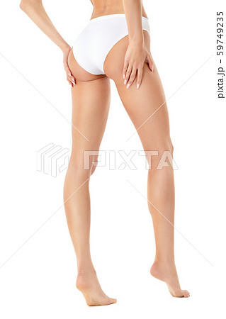 Slim woman's legs isolated on white background Slim woman's legs isolated on white background 59749235
