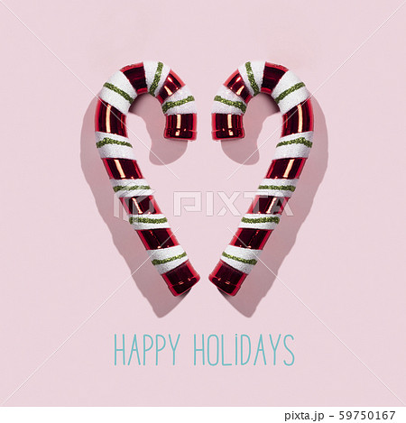 candy canes and text happy holidays 59750167