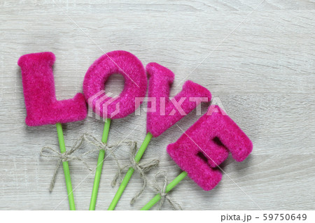 Pink Love letters on wooden floor. Pink Love letters on wooden floor. 59750649