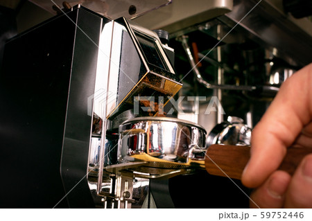 Macro shot grinding coffee on professional grinder Macro shot grinding coffee on professional grinder 59752446