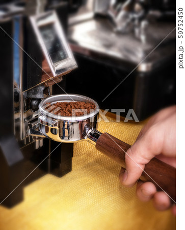 Macro shot grinding coffee on professional grinder Macro shot grinding coffee on professional grinder 59752450