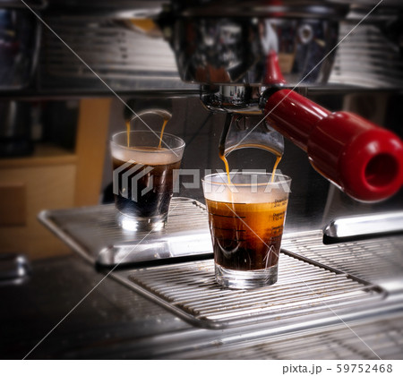 Making espresso in white mug in coffeeshop or cafe 59752468