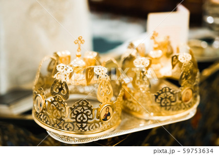 Golden crowns lying on the table in church Golden crowns lying on the table in church 59753634