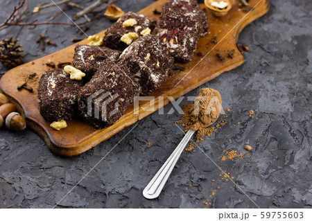 chocolate sweets pieces with cocoa, place under the inscription. chocolate sweets pieces with cocoa, place under the inscription. 59755603