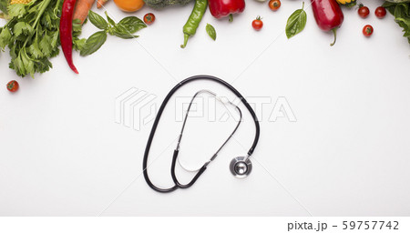 Stethoscope and vegetables for saving healthy in winter Stethoscope and vegetables for saving healthy in winter 59757742