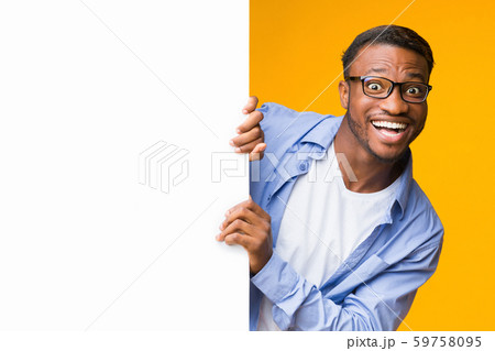 Funny Black Guy Looking Out Of White Board, Studio, Mockup 59758095