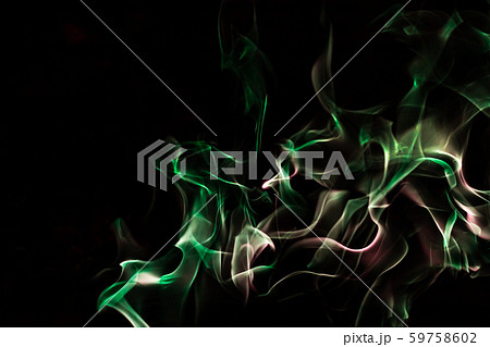 Green fire forms abstraction in black background 59758602