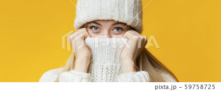 Close up of winter girl covering her nose and mouth 59758725