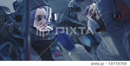 Astronauts and scientists testing spacesuit Astronauts and scientists testing spacesuit 59759769