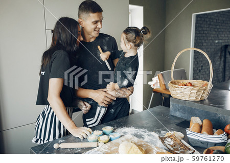 Family cook the dough for cookies at the kitchen 59761270
