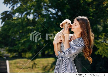 Elegant and stylish girl in a spring park Elegant and stylish girl in a spring park 59762884