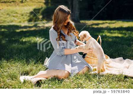 Elegant and stylish girl in a spring park Elegant and stylish girl in a spring park 59763840