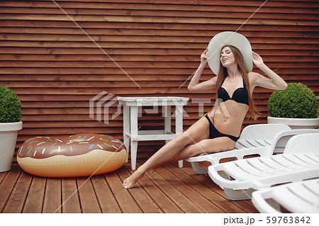 Elegant and stylish girl on a resort 59763842