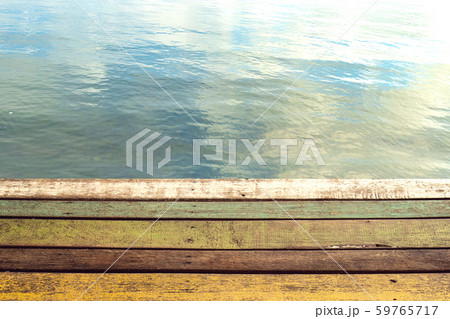 colour wood plank of pier with water of lake 59765717
