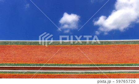 colour asian style temple roof tiles with white cloud and blue sky 59765720