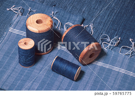 Indigo dyed yarn in reel and indigo dyed woven fabric 59765775