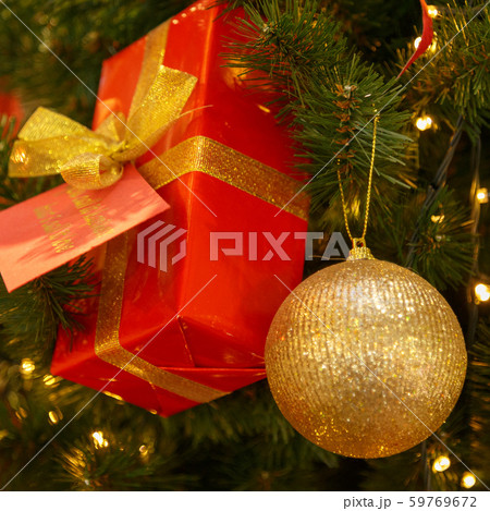 Christmas tree with silver bauble ornaments. Decorated Christmas tree closeup. Balls and illuminated Christmas tree with silver bauble ornaments. Decorated Christmas tree closeup. Balls and illuminated 59769672