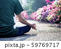 Asian woman training SukhAsana posture. 59769717