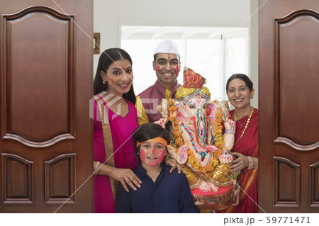 Family taking out Ganpati for immersion on the occasion of Ganesh Chaturthi Family taking out Ganpati for immersion on the occasion of Ganesh Chaturthi 59771471
