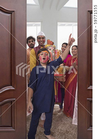 Family taking out Ganpati for immersion on the occasion of Ganesh Chaturthi Family taking out Ganpati for immersion on the occasion of Ganesh Chaturthi 59771555