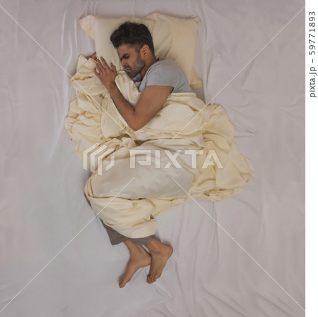 young man having a nightmare 59771893