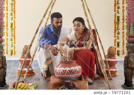 husband and wife celebrating pongal husband and wife celebrating pongal 59772201