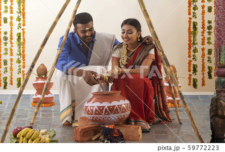 husband and wife celebrating pongal 59772223