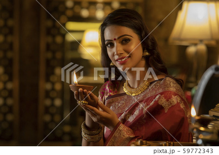 portrait of a woman with a diya 59772343