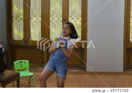 Young girl trying to catch a ball 59772703
