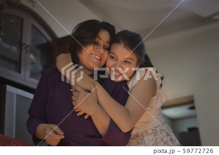 daughter hugging her mother daughter hugging her mother 59772726