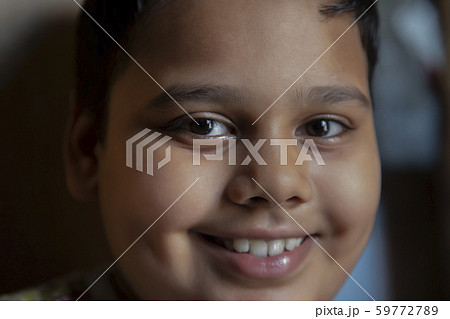 portrait of a young boy smiling portrait of a young boy smiling 59772789