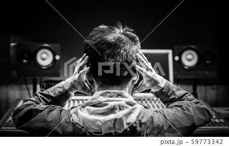 back of asian male music producer feel disappointed at bad sound in recording studio. music production, broadcasting, post production concept 59773342