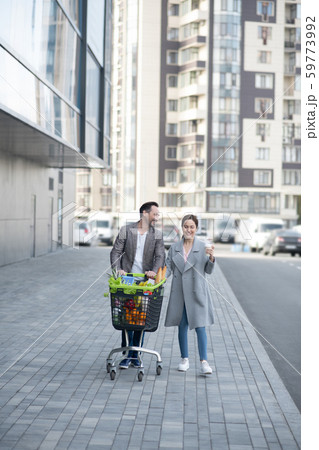Wife wearing grey coat spending time with husband at the weekend 59773992